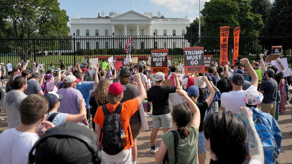 People protest the deployment of the National Guard and federal law enforcement into Washington, DC, in front of the White House on August 16. - Ken Cedeno/Reuters