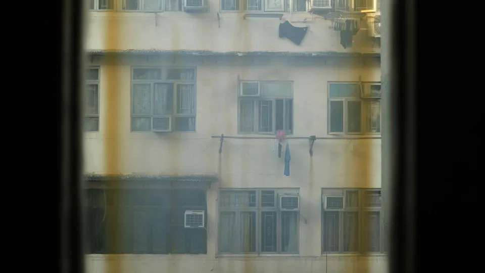 A view of the hallway of a subdivided flat in Sham Shui Po, Hong Kong, on July 4, 2025. - Catherine Phillips/CNN