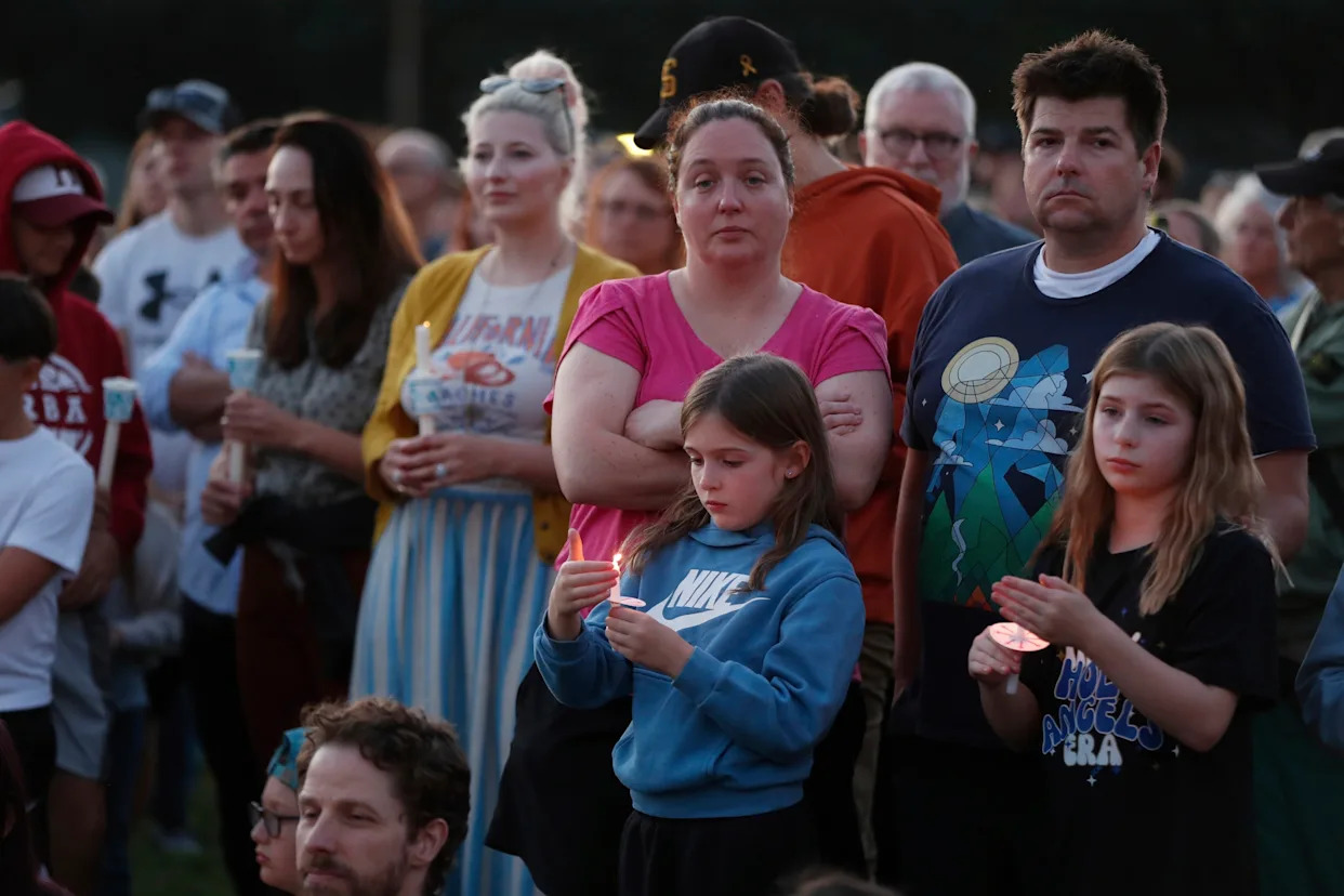 Hundreds honor 2 children killed and 17 people wounded in shooting at a Minneapolis Catholic school