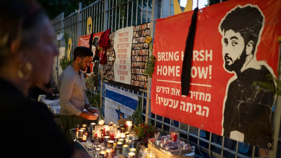 People light candles during a vigil in memory of Hersh Goldberg-Polin in Jerusalem on September 1, 2024. - Leo Correa/AP