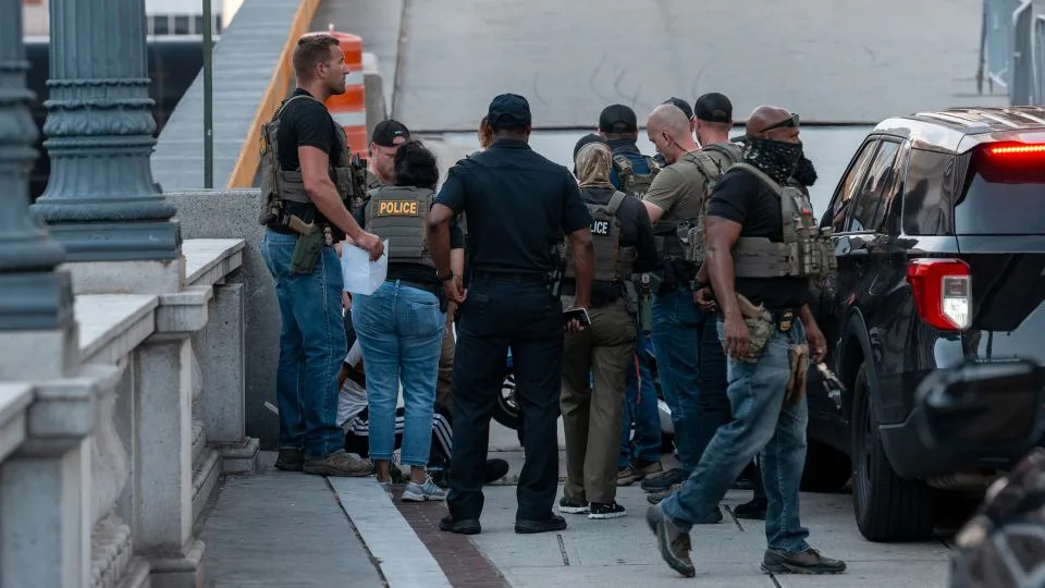 ICE and other federal agents take a delivery driver into custody on August 16 at Union Station in Washington, DC. - Andrew Leyden/Getty Images