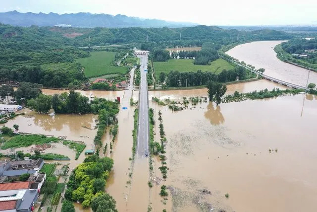 ADEK BERRY/AFP via Getty  Extreme floods hit eastern and northern China on July 28