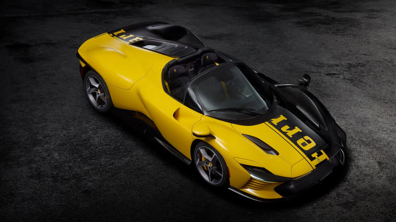 A top three-quarter view of the yellow and black Ferrari Daytona SP3