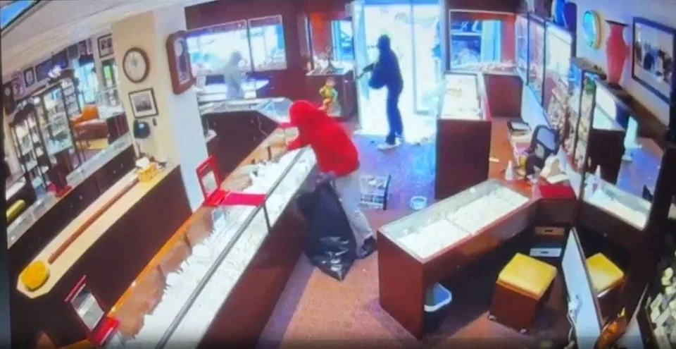 Thieves smashing display cases