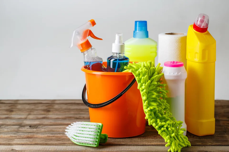 Cleaning products in a bucket.