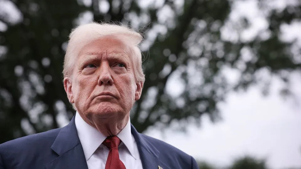 President Donald Trump speaks to the media as he departs the White House on Friday. - Win McNamee/Getty Images