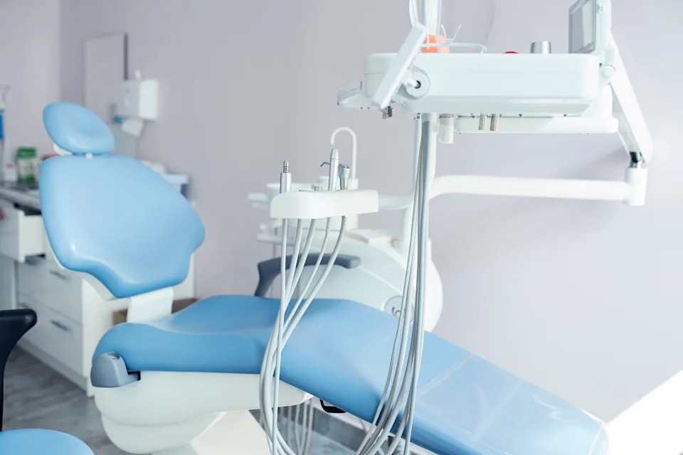 Dental office with a modern dentist chair and equipment, ready for patient care