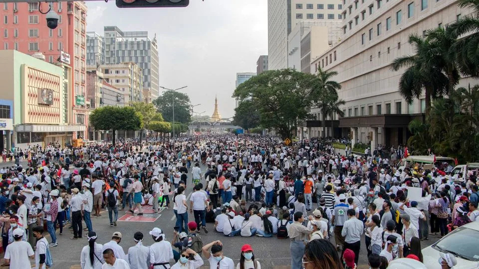 Protesters sit in the middle of the street during the demonstration to protest against the military coup on February 1, 2021 in Yangon, Myanmar. - Santosh Krl/SOPA Images/LightRocket/Getty Inmages/File