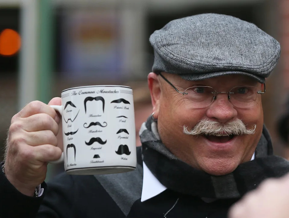 Robert Goldhorn is photographed after winning a mug for best mustache during the 5th Annual Des Moines Tweed Ride Sunday, Nov. 9, 2014.