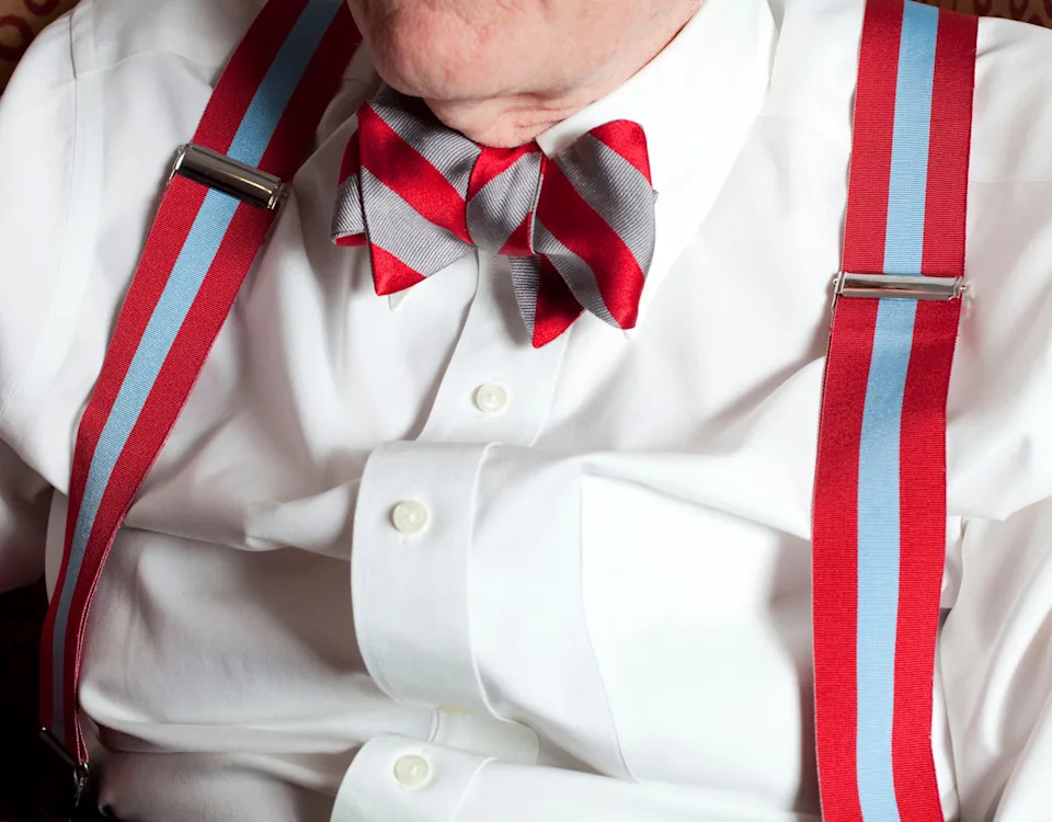 Former Ohio State University President E. Gordon Gee, photographed in his office in January 2012, sporting the official OSU bowtie and braces — not suspenders, he said.