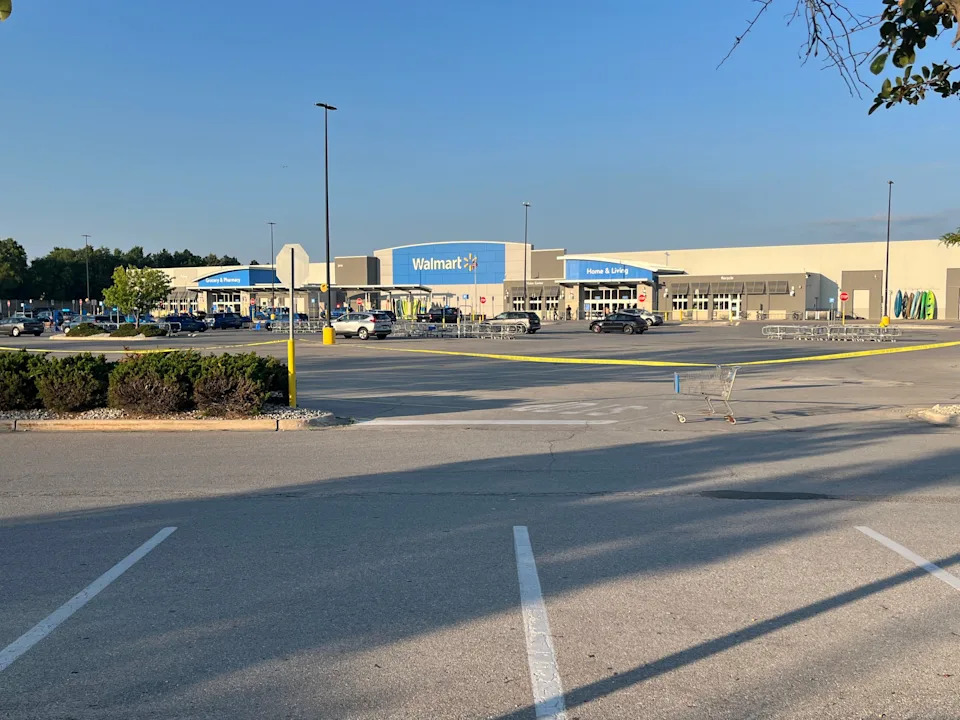 More than 10 police cars sit in the Walmart parking lot in Traverse City, Michigan, after a mass stabbing incident left 11 injured.