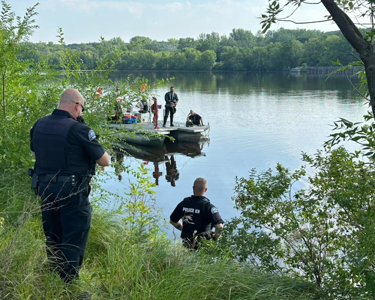 <span>Authorities in Sartell, Minnesota, work to pull out a submerged car that belonged to a man reported missing in 1967.</span><span>Photograph: Sartell, Minnesota, police department</span>