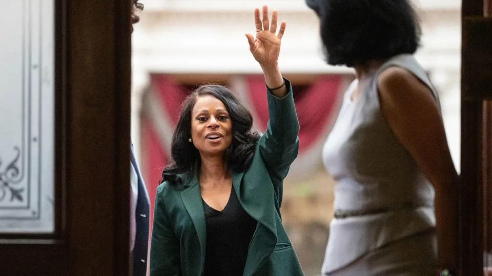 State Rep. Nicole Collier waves to supporters from inside the House Chamber at the Texas Capitol. - The Austin American-Statesman/He/Hearst Newspapers/Houston Chronicle via Getty Imag