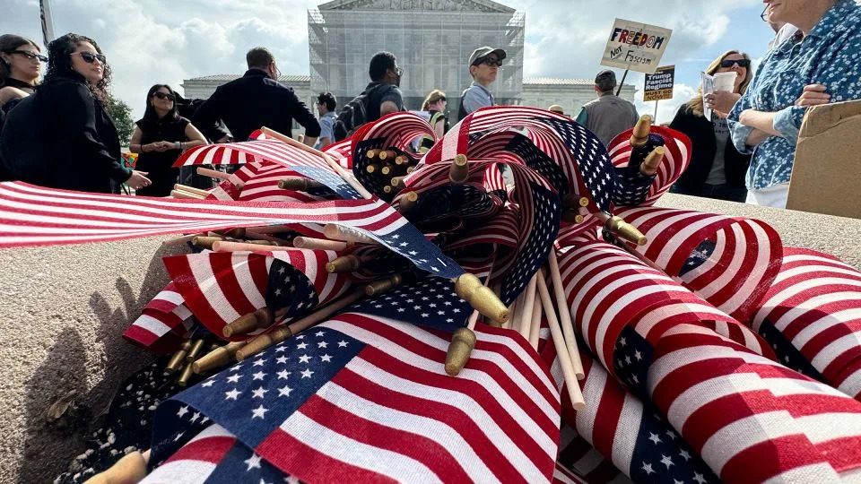 American flags are seen during a protest outside the Supreme Court over President Donald Trump&#39;s move to end birthright citizenship as the court hears arguments over the order on May 15. - Drew Angerer/AFP/Getty Images