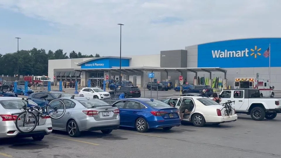 Emergency personnel stand outside a Walmart store, where a stabbing incident occurred, in Traverse City, Michigan, on Saturday. - Jerome Hartl/UGC/Reuters