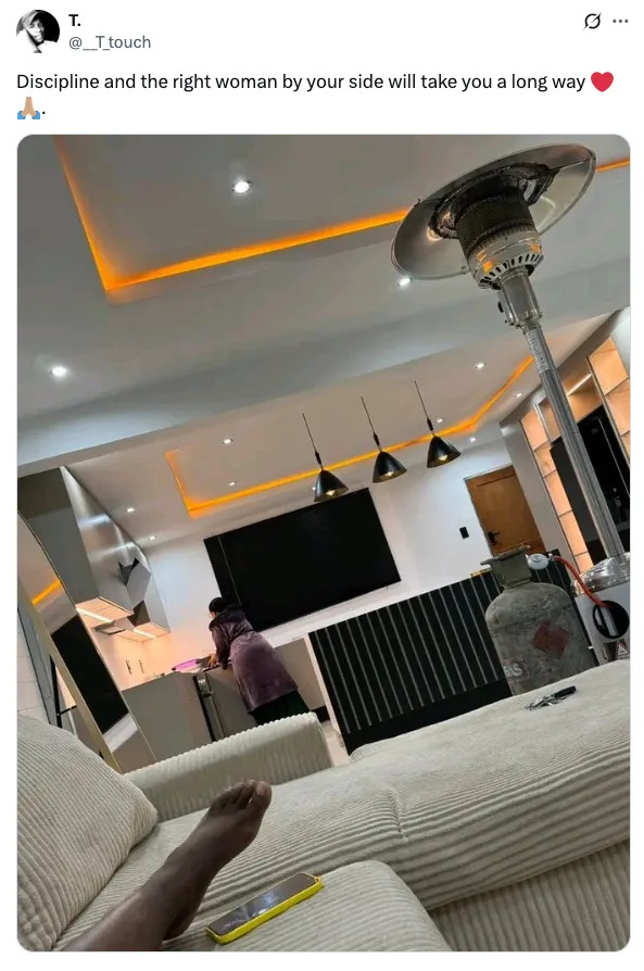 Person relaxing on a couch with phone, viewing a modern kitchen where someone is cooking. Caption emphasizes partnership and discipline