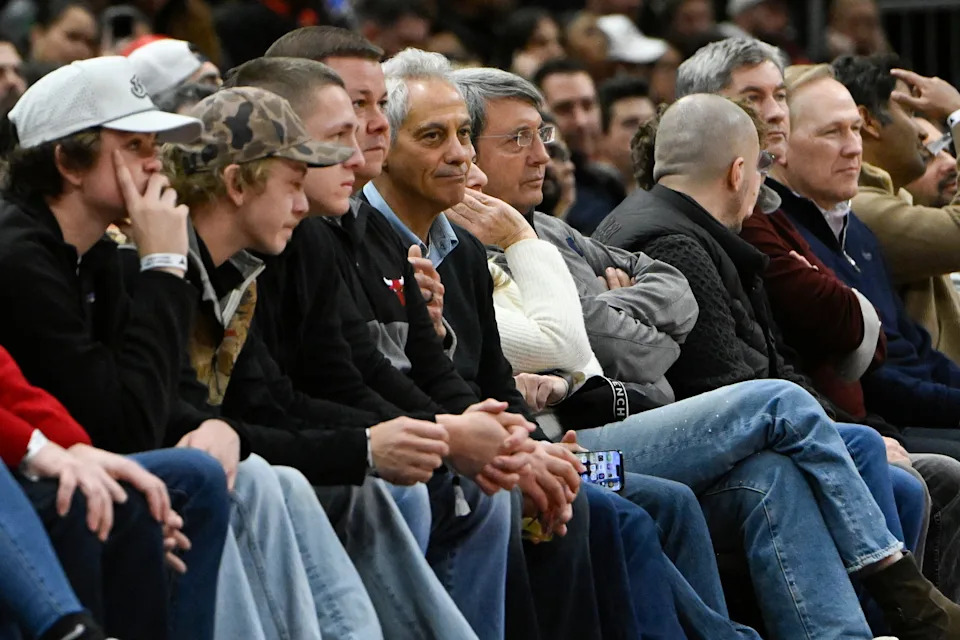 Former Chicago mayor and former White House Chief of Staff, Rahm Emanuel (center) looks on during the first half of the game between the Chicago Bulls and the Miami Heat at United Center.