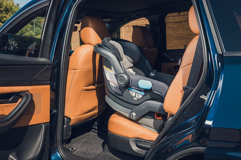 2024 mazda cx 90 with rear facing infant seat in second row behind driver