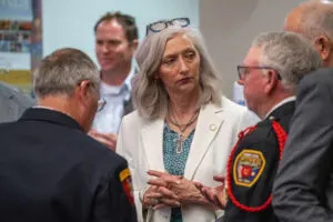  State Sen. Tanya Storer of Whitman, center, meets with state and local officials for an update on the disaster response to a major fire in her north-central legislative district. April 23, 2025. (Zach Wendling/Nebraska Examiner)