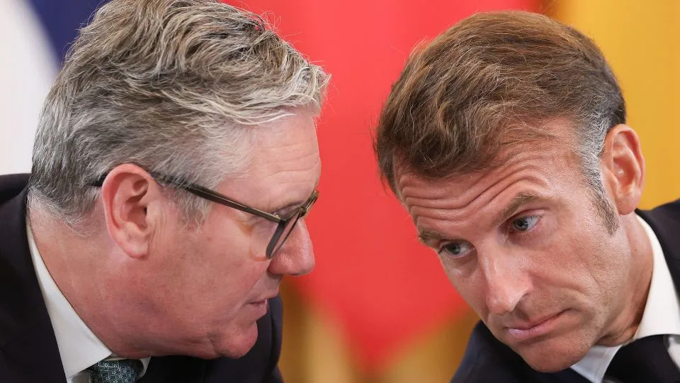 British Prime Minister Keir Starmer and French President Emmanuel Macron talk during the White House meeting on Monday. - Win McNamee/Getty Images North America/Getty Images