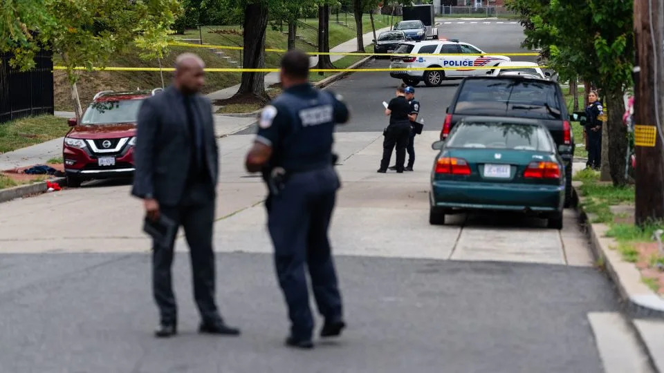 Metropolitan Police Department officers respond to a shooting in the Minnesota Avenue NE and Ames Street NE area of Washington, DC, on Wednesday. - Eric Lee for CNN