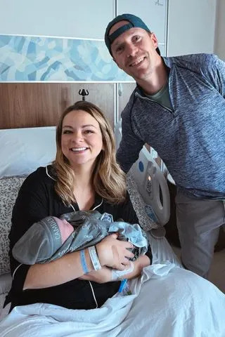 Rachel Miller Rachel Miller (left) with her husband Ben (right) and their son.