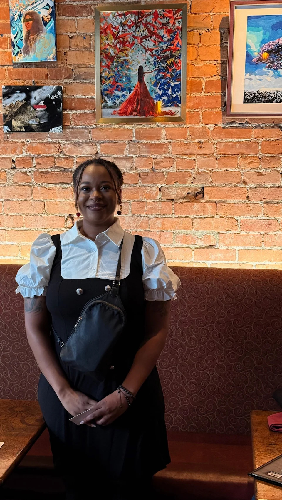 Shayla Marshall celebrates her art work and her liberation from her past. (Photo by Alan Johnson for the Ohio Capital Journal.)
