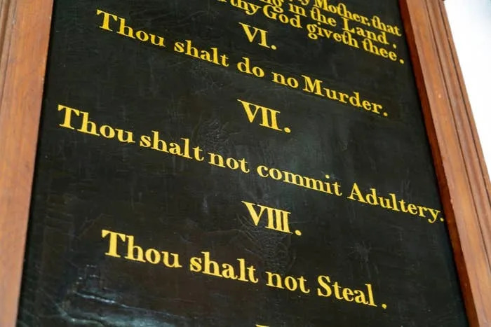 Text from a religious plaque showing commandments: "Thou shalt do no murder, commit adultery, steal."
