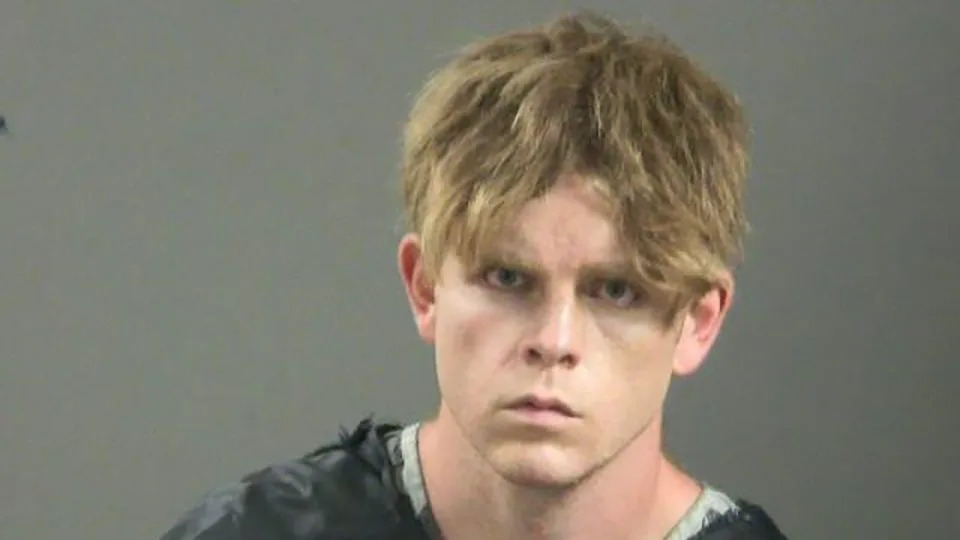 Andrew McGann is seen in a booking photo shortly after he was arrested at a hair salon in Springdale, Arkansas. - Washington County Sheriff’s Office