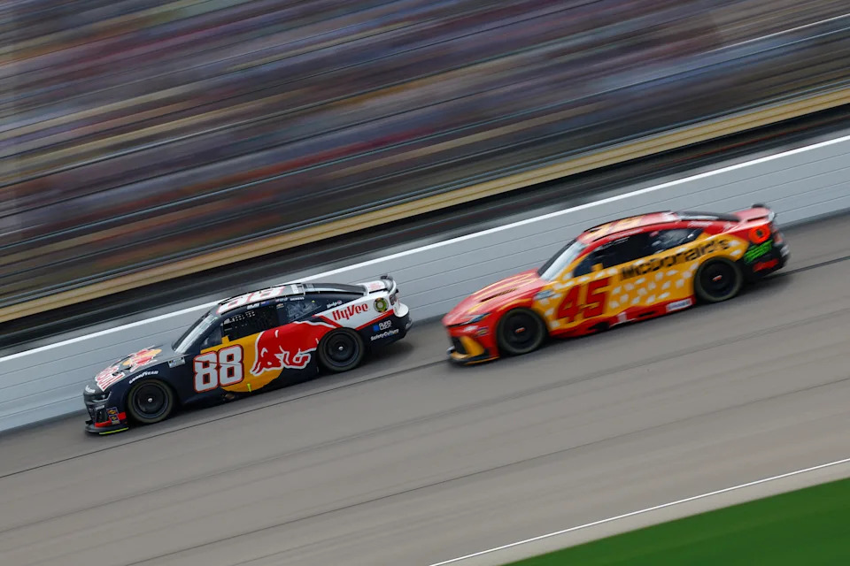 NEWTON, IOWA - AUGUST 03: Shane Van Gisbergen, driver of the #88 Red Bull Chevrolet, and Tyler Reddick, driver of the #45 McDonald's Toyota, race during the NASCAR Cup Series Iowa Corn 350 Powered by Ethanol at Iowa Speedway on August 03, 2025 in Newton, Iowa. (Photo by Sean Gardner/Getty Images)