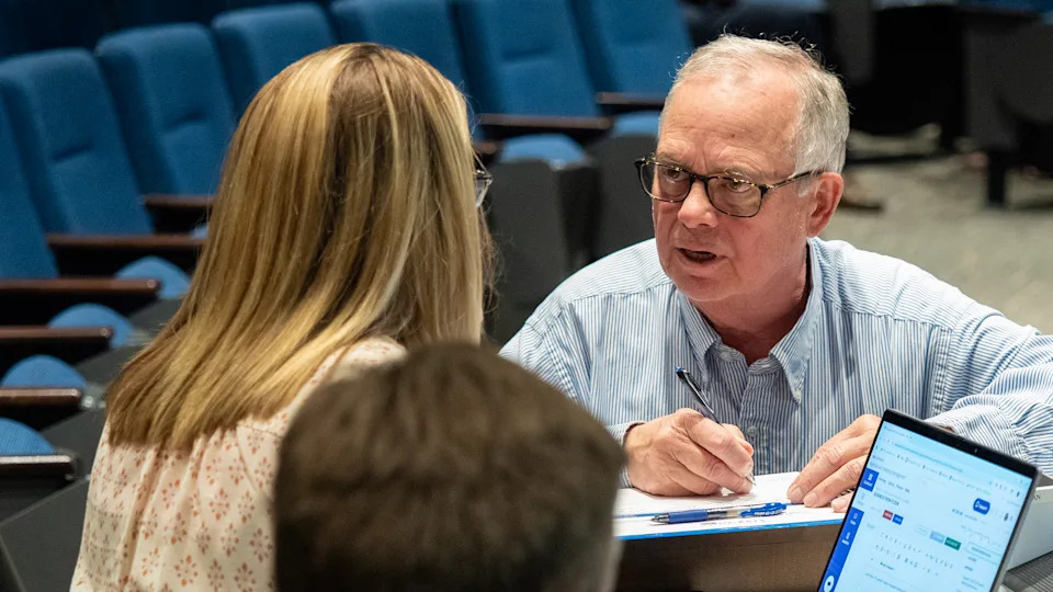 Retired federal prosecutor Leon Patton records his appearance before the Lenexa City Council during an Aug. 19, 2025, meeting.