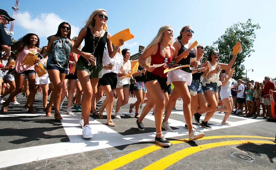 New members of sororities head to their prospective house as they leave Bryant-Denny Stadium during the University of Alabama's Panhellenic Bid Day on Saturday, Aug. 19, 2017. Of the 2,589 young women that participated in UA's Panhellenic Fall recruitment, 2,338 received bids for one of the 16 sororities during UA's annual Bid Day in Tuscaloosa.  [Staff Photo/Erin Nelson]