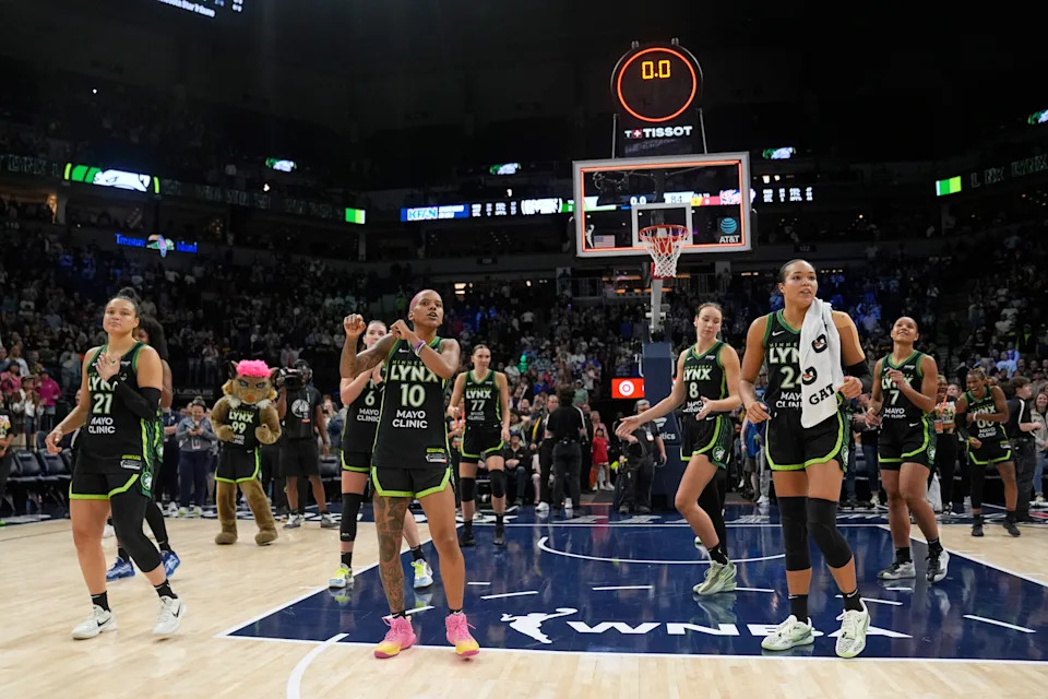 Minnesota Lynx players dance after a WNBA basketball game against the Indiana Fever, Sunday, Aug. 24, 2025, in Minneapolis. (AP Photo/Abbie Parr)