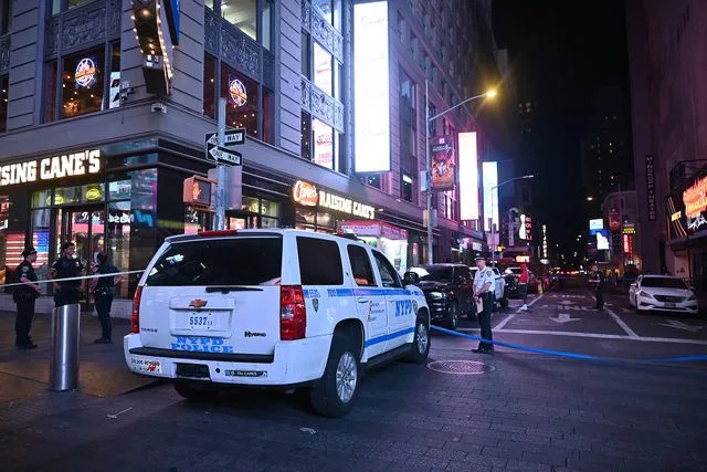 Kyle Mazza/NurPhoto via AP Police at scene of Times Square shooting on Aug. 9