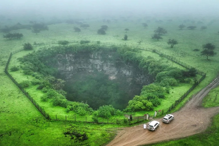Mind the gap: tourists drawn to Oman's giant sinkholes