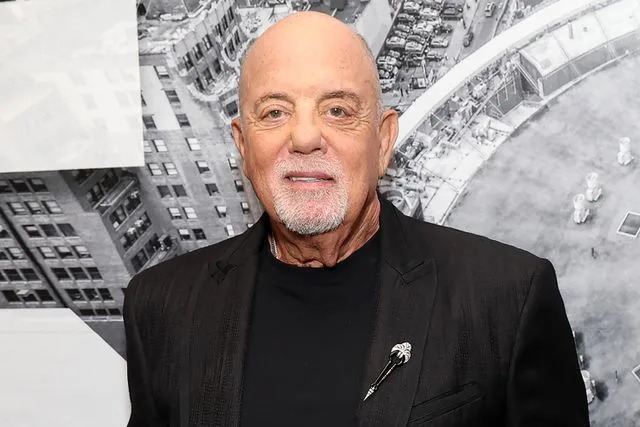 Kevin Mazur/Getty Billy Joel is presented with the Key to the City of New York backstage before the last show of his residency at Madison Square Garden on July 25, 2024 in New York City.