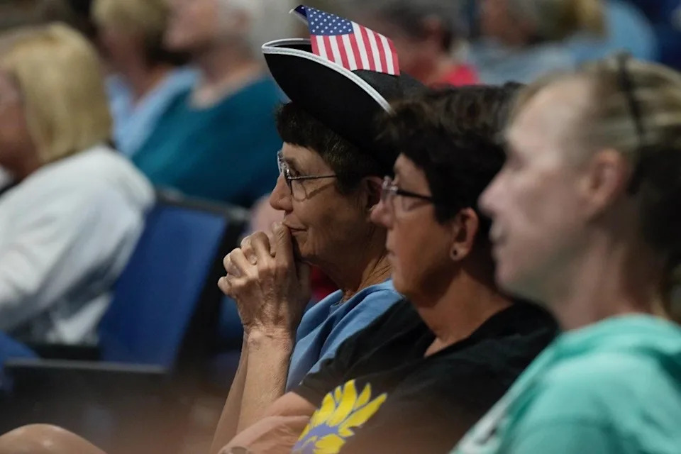 Members of the crowd quieted slightly forty minutes in to Davidson's town hall.