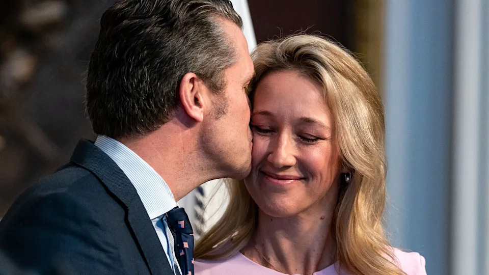 Secretary of Defense Pete Hegseth kisses his wife, Jennifer Rauchet. / Kent Nishimura / Getty Images