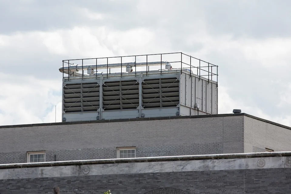 In this photo, a water cooling tower found to have traces of Legionella bacteria, which may have helped cause the recent outbreak of Legionnaires' disease in the Bronx, is seen atop a United States Post Office building on August 13, 2015, in the Bronx, New York City.