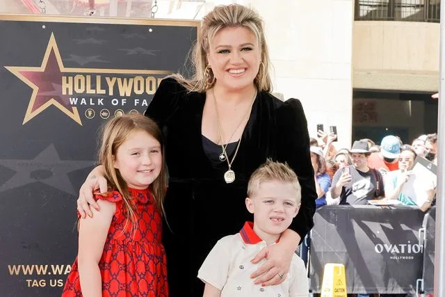 Kevin Winter/Getty Kelly Clark with her kids at the Hollywood Walk Of Fame in 2022