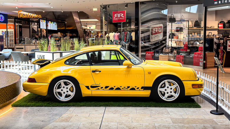 Szeged, Hungary - July 13th 2025: View on a yellow Porsche 911 (964) Carrera on display.