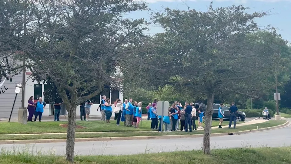 Police officers speak to Walmart employees following a mass stabbing incident in Traverse City, Michigan. / Jerome Hartl / Jerome Hartl via REUTERS