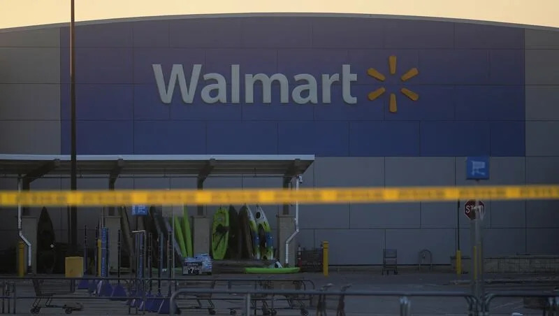 Police tape is seen outside a Walmart where multiple people were stabbed in a violent attack Saturday, July 26, 2025, in Traverse City, Mich.