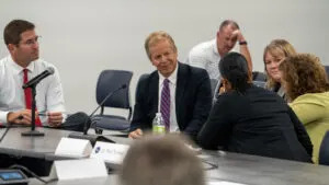  A small group of the School Financing Review Commission meets during its inaugural meeting. From left: Superintendent Jason Dolliver of Pender Public Schools, Nebraska Treasurer Tom Briese, Omaha School Board member Shavonna Holman, Nebraska Property Tax Administrator Sarah Scott of North Platte and State Sen. Jana Hughes of Seward. Aug. 12, 2025. (Zach Wendling/Nebraska Examiner)