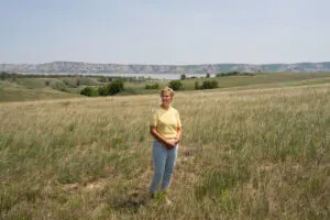 Janice Arnson on land once owned by her family. Arnson and her siblings inherited mineral rights from their mother in Williams County, North Dakota. (Sarahbeth Maney/ProPublica)