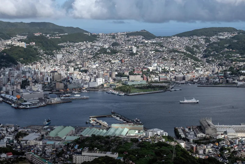 A ship sales out to sea from Nagasaki Port which, along with the rest of the city, was completely destroyed by an atomic bomb in World War Two, on August 8, 2020 in Nagasaki, Japan. / Credit: Getty Images