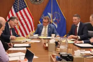  North Dakota Agriculture Commissioner Doug Goehring, left, Gov. Kelly Armstrong, center and Attorney General Drew Wrigley hold an Industrial Commissioner meeting on May 22, 2025, in the North Dakota Capitol in Bismarck. (Mary Steurer/North Dakota Monitor)