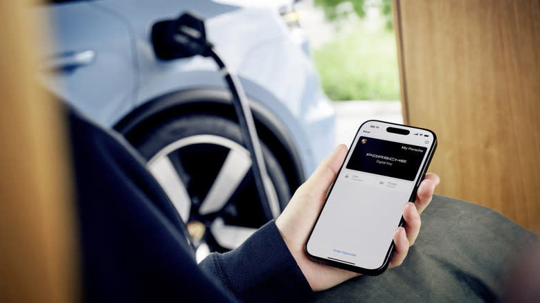 An owners using the Porsche App on their smartphone