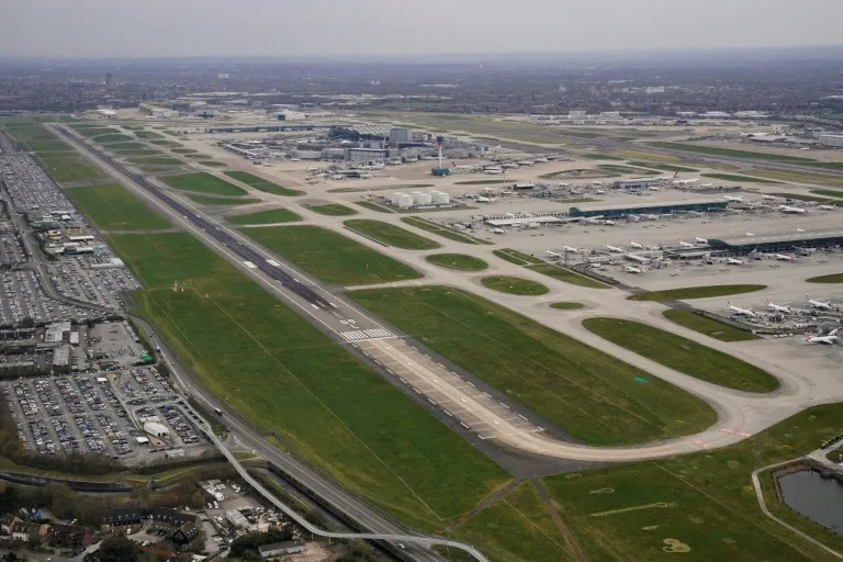 An aerial photograph taken on March 21, 2025 shows planes parked on the tarmac of Heathrow Airport, which has submitted a $49 billion to expand the site and build a third runway (STR)