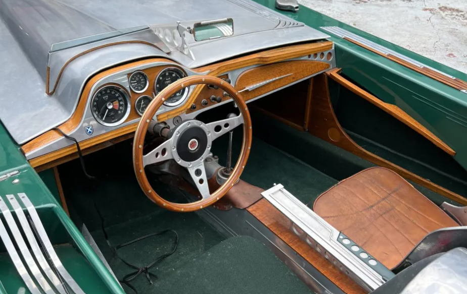 interior of a classic car showcasing wood accents and dashboard instruments